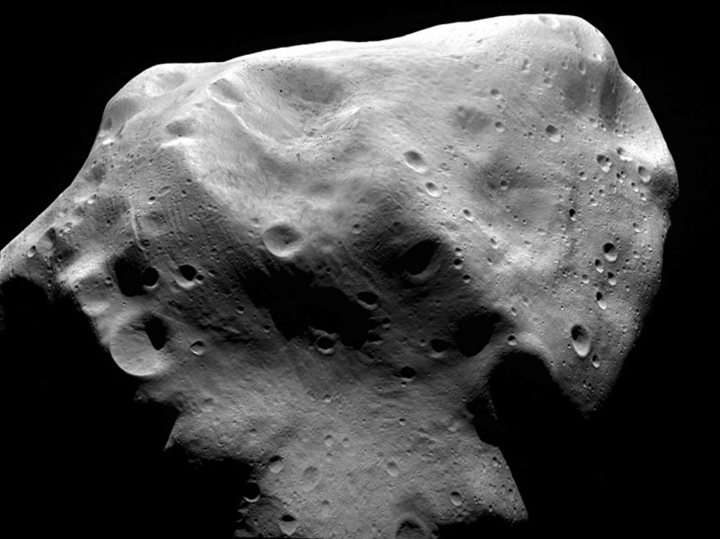 Asteroid 21 Lutetia is a large, heavily cratered main-belt asteroid (located between the orbits of Mars and Jupiter), made of metal rich rock. It has an irregular shape with estimated dimensions of 132 × 101 × 76 kilometers, and a mass of approximately 1.700 × 1018 kilograms.