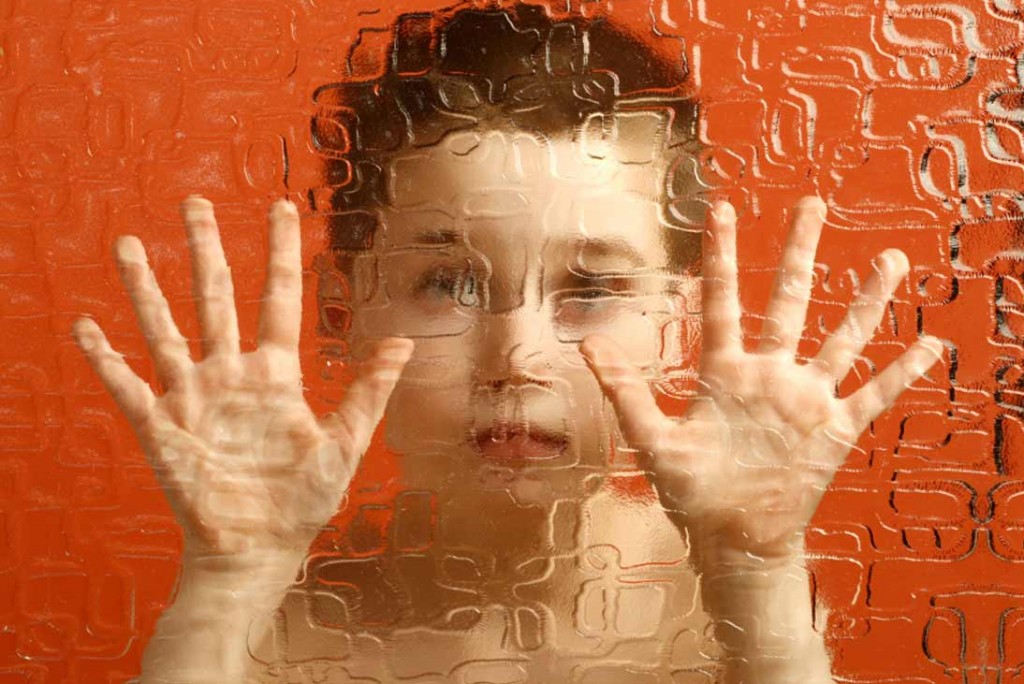 Child looking through glass