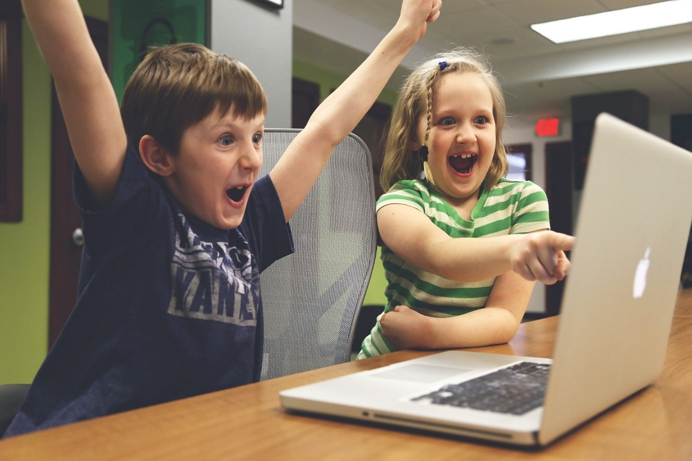 Happy kids at computer