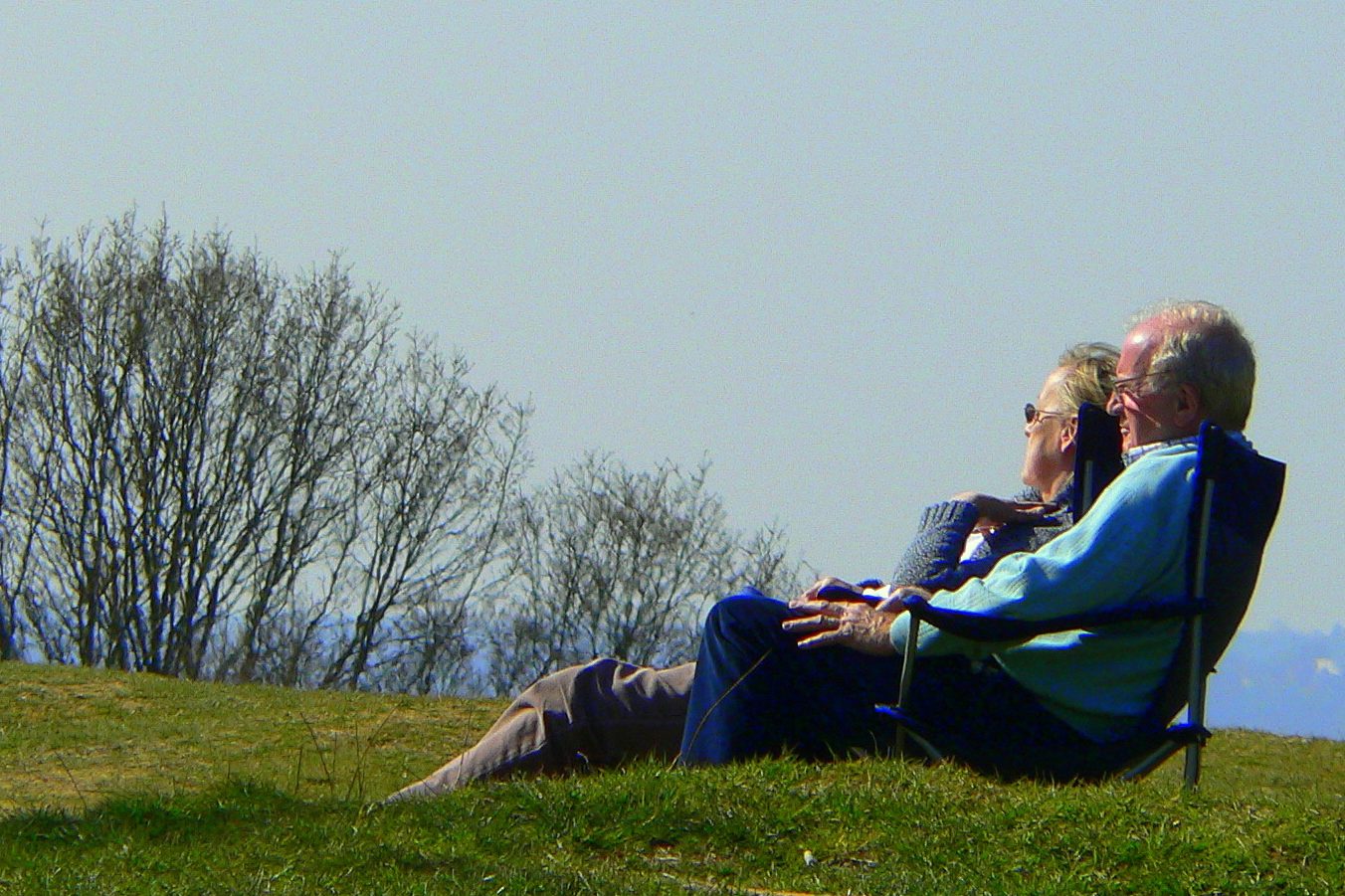 Elderly couple on hill.