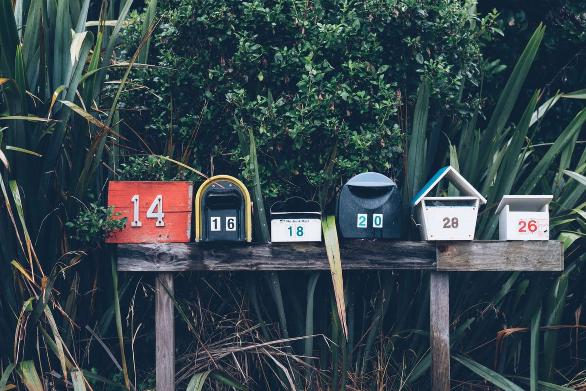 Row of wooden mail boxes
