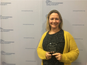 Heather Ferguson holding her Psychonomics Award